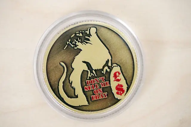 A mysterious coin, with a Banksy rat on the front, that arrived in our mailbox yesterday.